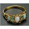 Image 1 : A Victorian gold, opal and emerald ring, centred with an oval white opal between pairs of small pale