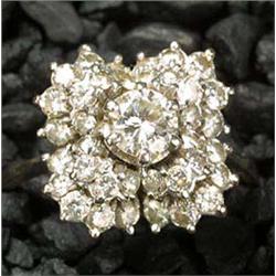 An 18ct white gold and diamond square cluster ring, centred with a round brilliant approx. 0.48cts w