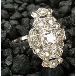 A diamond panel ring, the cartouche shaped panel centred with an Edwardian-cut stone approx. 0.85cts