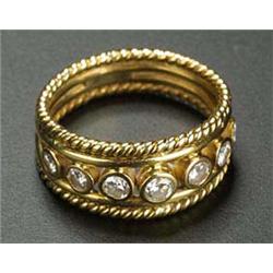 A modern diamond five stone ring, the graduated round brilliants approx. 0.28cts total, rub-over set