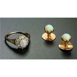 An opal and diamond cluster ring, centred with an oval white opal within an old-cut diamond twelve s