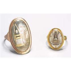 Two 18th century gold mourning rings, each with an oval glazed panel, one depicting a lady in mourni