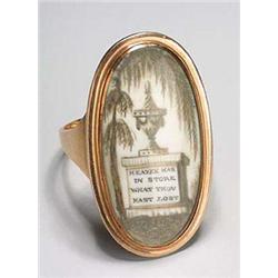 An 18th century gold mourning ring, the head with an oval glazed panel depicting a funery urn and pe