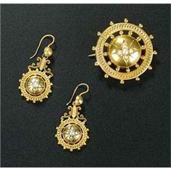 A pair of Victorian gold and half pearl pendent earrings and a brooch in Etruscan style, each round.