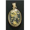 A 19th century Japanese Shakudo and gilt metal oval locket, the front and back set with oval Shakudo