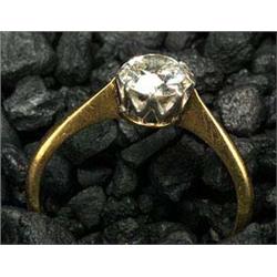 An early 20th century gold and diamond solitaire ring, the early modern round brilliant approx. 1.08
