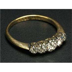 An early 20th century gold and diamond five stone ring, the graduated old-cut stones approx. 0.66cts