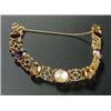 An early 20th century rose gold and multi-gem bracelet, centred with a round blister pearl, two oval