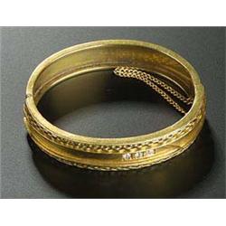 A Victorian 15ct gold and small diamond three stone hinged bangle, the front with stylised brickwork