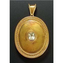 A Victorian gold oval locket, rub-over set at the centre with an oval mixed-cut peridot within a bea