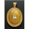 A Victorian gold oval locket, rub-over set at the centre with an oval mixed-cut peridot within a bea