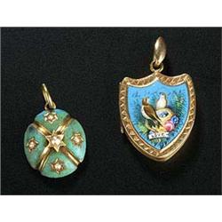 A late 19th century Swiss enamelled shield shaped locket, the front polychrome enamelled with a pair