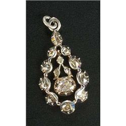 An 18th century rose diamond drop, the pear-shaped frame enclosing a scroll and collet swing pendant