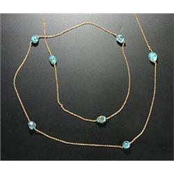 An early 20th century gold and turquoise bead necklace, the trace chain strung with ten baroque-shap