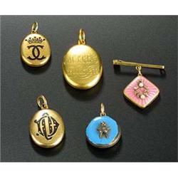 A collection of lockets and a watch chain, comprising; a Victorian gold oval locket engraved with a.