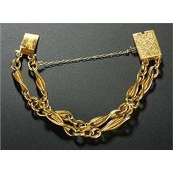 A Victorian gold fancy link chain adapted as a two row bracelet, each link stamped '15 .625', on a r