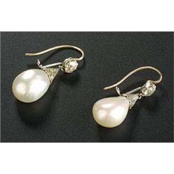 A pair of Edwardian pearl and diamond earrings, the drop-shaped baroque pearls approx. 12.5 x 9.8mm.