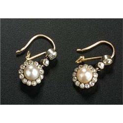 A pair of late Victorian pearl and diamond cluster pendent earrings, each cluster centred with a rou