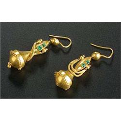 A pair of Victorian gold and emerald pendent earrings, in Etruscan style, each formed of an oval and