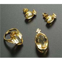 A group of golden beryl and diamond jewellery, comprising; a ring centred with an oval mixed-cut yel
