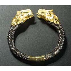 A modern torque bangle, the hoop of graduated spiral twisted metal wire and elephant hair with yello