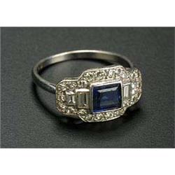 An Art Deco platinum, sapphire and diamond shaped-rectangular panel ring, centred with a square step