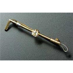 An early 20th century gold and diamond solitaire brooch in the form of a riding crop, the old-cut st