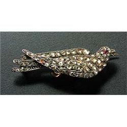 A late Victorian diamond bird brooch in the form of a dove, set throughout with rose diamonds and sm