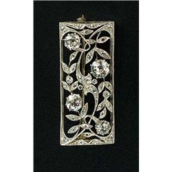 An early 20th century diamond rectangular panel brooch, of openwork scrolling leaf design, set with.