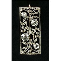 An early 20th century diamond rectangular panel brooch, of openwork scrolling leaf design, set with.