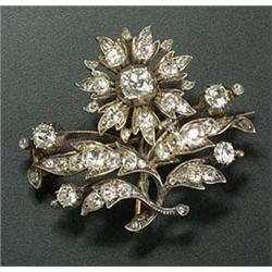 A 19th century diamond flower brooch, the flower head centred with a cushion shaped old-mine cut dia