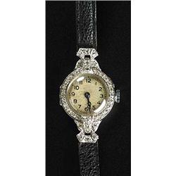 Vertex, a lady's platinum and diamond round wristwatch, circa 1935, no.1214/9120, silvered dial with