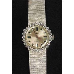 Pagy, a Continental lady's white metal and diamond round bracelet watch, circa 1970, silvered dial w