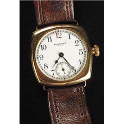 Waltham, a gentleman's 9ct gold cushion shaped wristwatch, circa 1928, white enamel dial with red tw