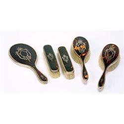 A silver and tortoiseshell mounted five piece dressing table set, comprising; two oval hair brushes,