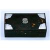 A late Victorian tortoiseshell and silver mounted cigarette box, the hinged cover with a central mon