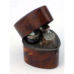 A 19th century tortoiseshell heart-shaped double scent bottle case, the hinged cover enclosing a mir