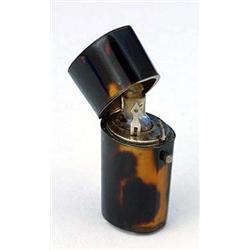 A 19th century tortoiseshell scent bottle case, of slightly tapering oblong form, the hinged cover w