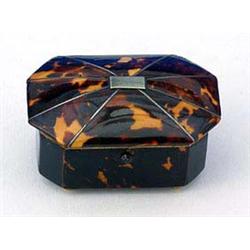 A 19th century tortoiseshell small canted rectangular box, the hinged cover with silver banding, 6.5