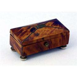 A 19th century tortoiseshell and brass strung small rectangular box on turned ivory feet, 6.5 cm (3.