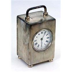 A late Victorian silver cased striking carriage clock with alarm, white dial with Roman numerals and