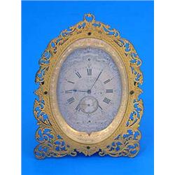 A late 19th century French gilt brass 'boudoir' timepiece, silvered dial engraved with ribbons, scro