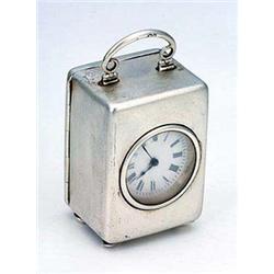 A late Victorian silver cased small carriage timepiece, white dial with Roman numerals, silver case.
