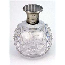 A cut glass and silver mounted spherical scent bottle, the engine turned hinged cover Sheffield 1924