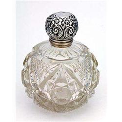 A cut-glass and silver mounted spherical scent bottle, the hinged cover embossed with flowers, leave