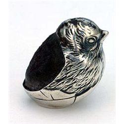A collection of small silver and other items, comprising; an Edwardian pin cushion in the form of a.