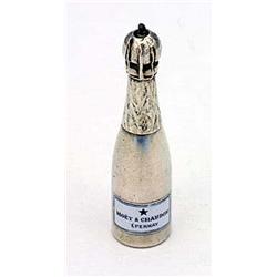 An Asprey propelling pencil in the form of a champagne bottle with an enamelled label 'Moet & Chando