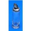 A silver 'chick' pin cushion, mounted as the cover of a glass facetted cylindrical needle bottle, Bi