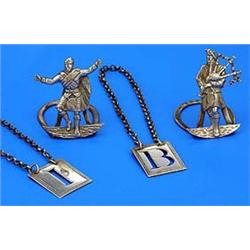 A pair of Scottish menu holders in the form of a piper and a dancer, Edinburgh 1912 by Hamilton and.