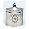 An oval tea caddy engraved with a ribbon bow and floral cartouche with crest, the hinged cover with.